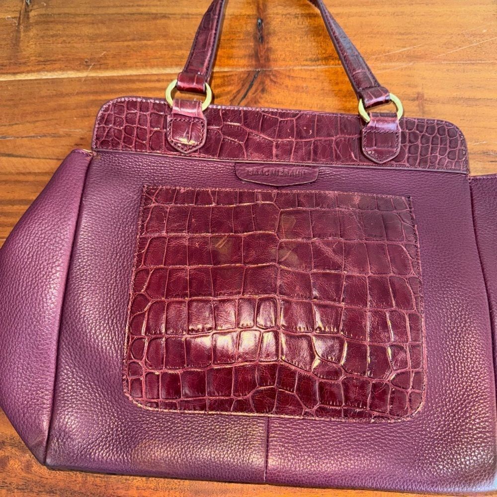 Issac Mizrahi leather handbag with large faux croc pocket.  
Magnetic closure